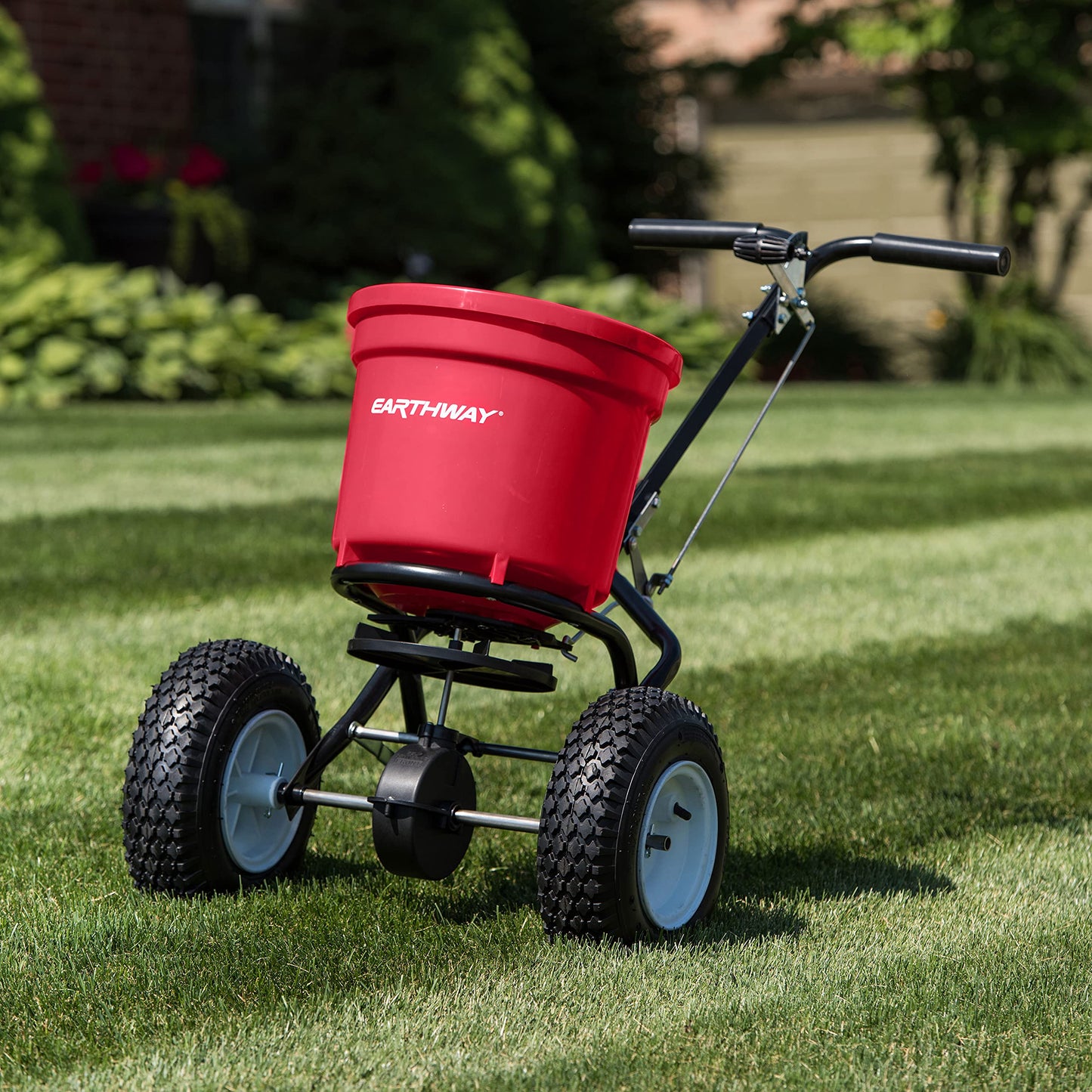 EarthWay 2150 Commercial 50 LB Broadcast Fertilizer Spreader. Heavy-Duty Walk-Behind Push Garden Seeder with Adjustable Drop Rate and Driving Handle. Large 13 inch Pneumatic Stud Tires