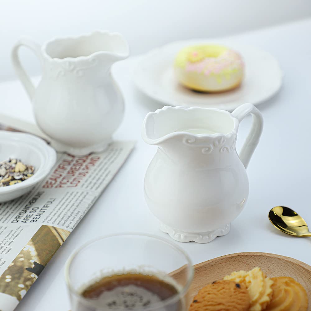 Sizikato Pure White Porcelain Creamer Pitcher with Handle, 6oz Embossed Ceramic Serving Pitcher for Tea Coffee Milk.