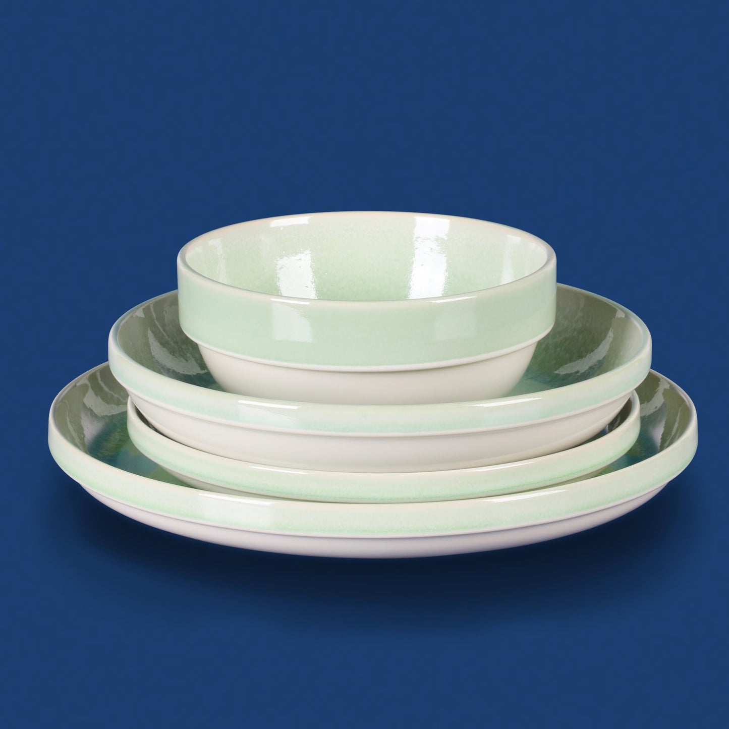 Sur La Table Kitchen Essentials Banquette 16 Piece Double Bowl Plates and Bowls Reactive Glaze Stoneware Dinnerware Set - Green