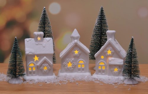 Mark Feldstein & Associates Pre-Lit LED Cozy Knit Winter Village - 7-Piece Unglazed Porcelain Tabletop Set