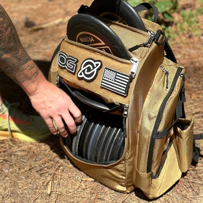 Discology Disc Golf OG V3 Disc Golf Bag | 26+ Disc Capacity | Premium Disc Golf Backpack Bag | Tough, Durable Design | 2 Large Top and Side Compartments | Top Patch Panel with Three Patchs Included