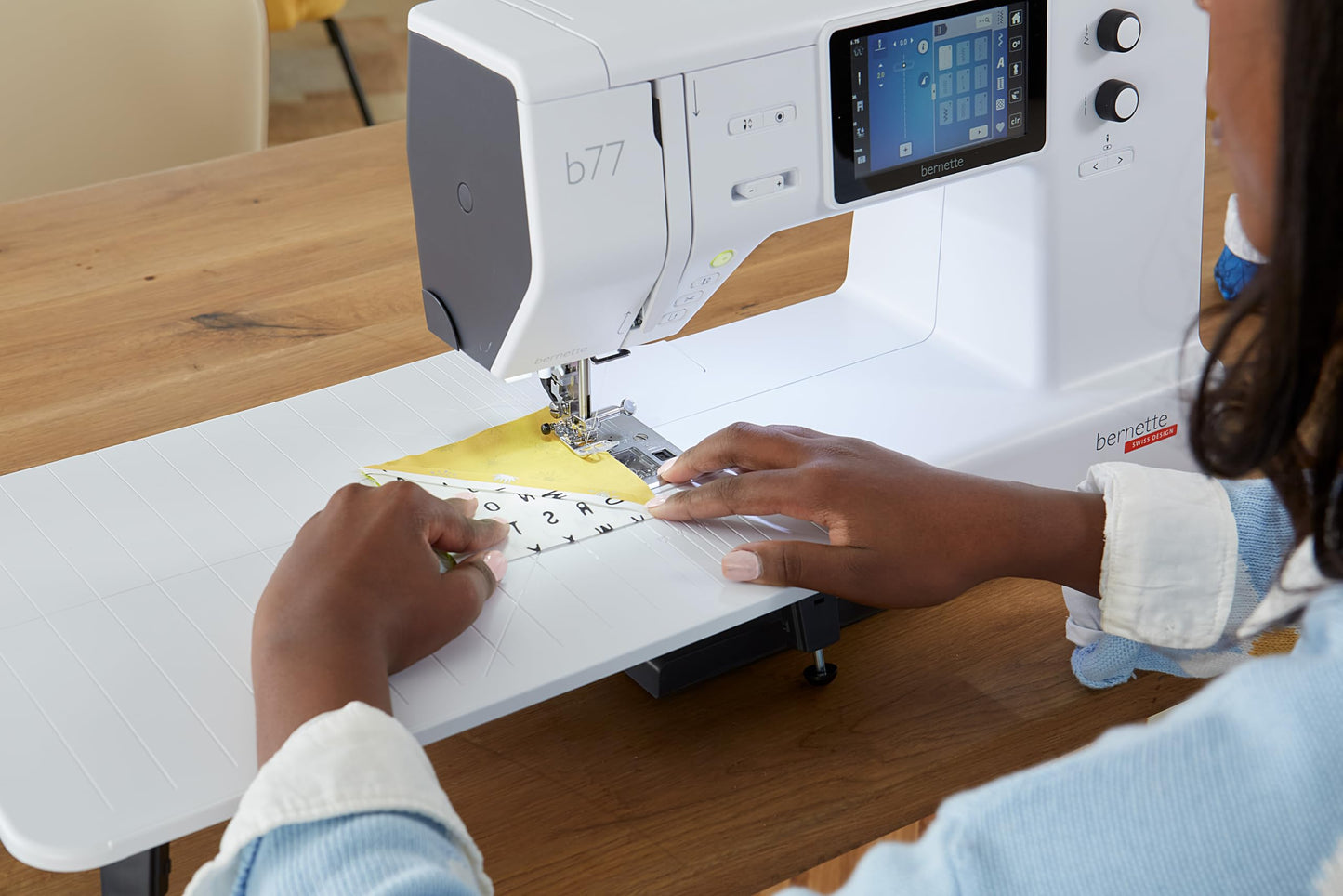 Bernette B77 Computerized Sewing Machine | Heavy Duty, Quilting & Embroidery Kit with Extension Table, Presser Feet, Bobbins, Thread Spools, Needles, Rotary Cutter, LCD Display & $200 Bonus Bundle