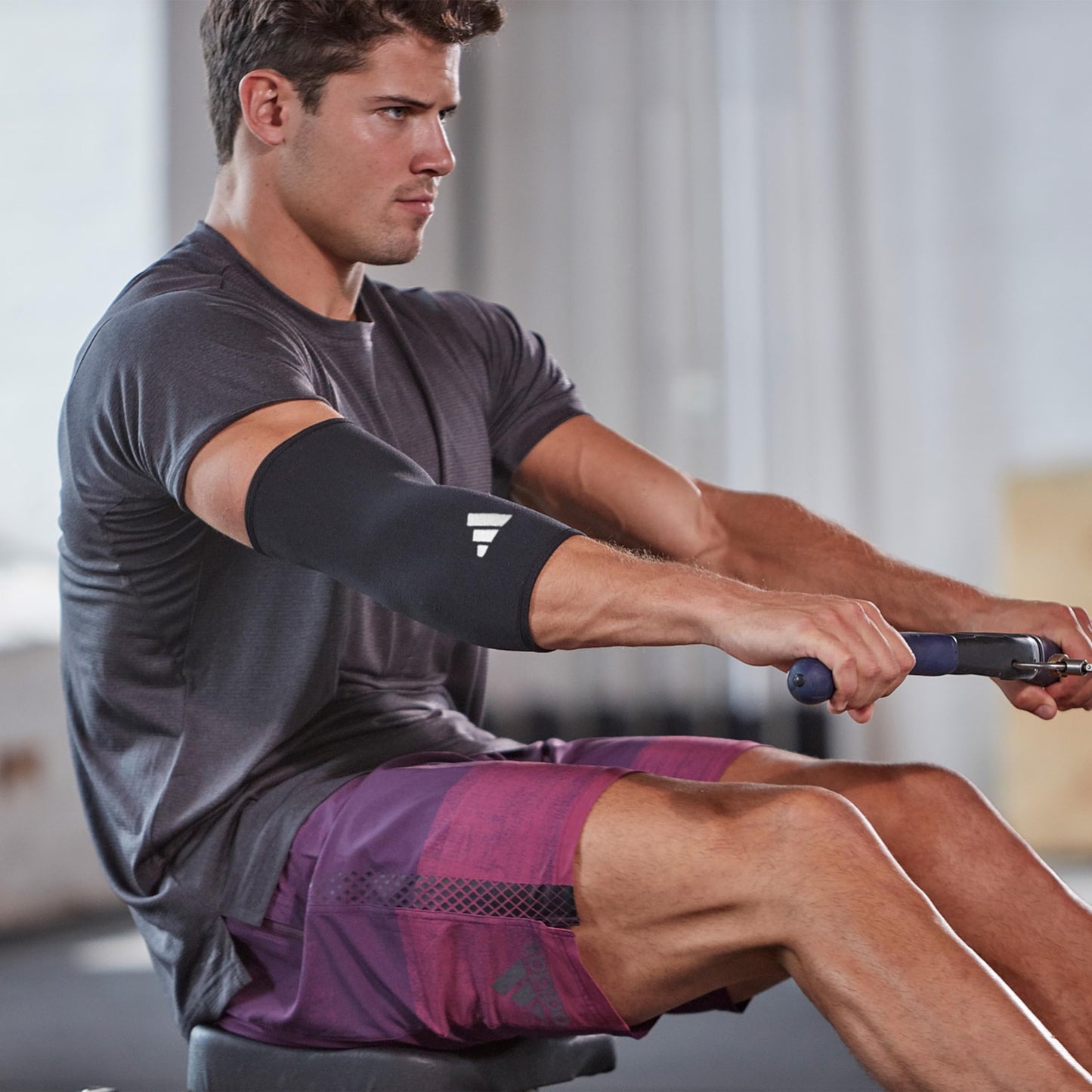 adidas Elbow Support Sleeve - Seamless and Smooth Elbow Support for Training, Competitions, and General Fitness - Ergonomic Design, Nylon Trim - Durable & Breathable - Black (Red Logo), Large