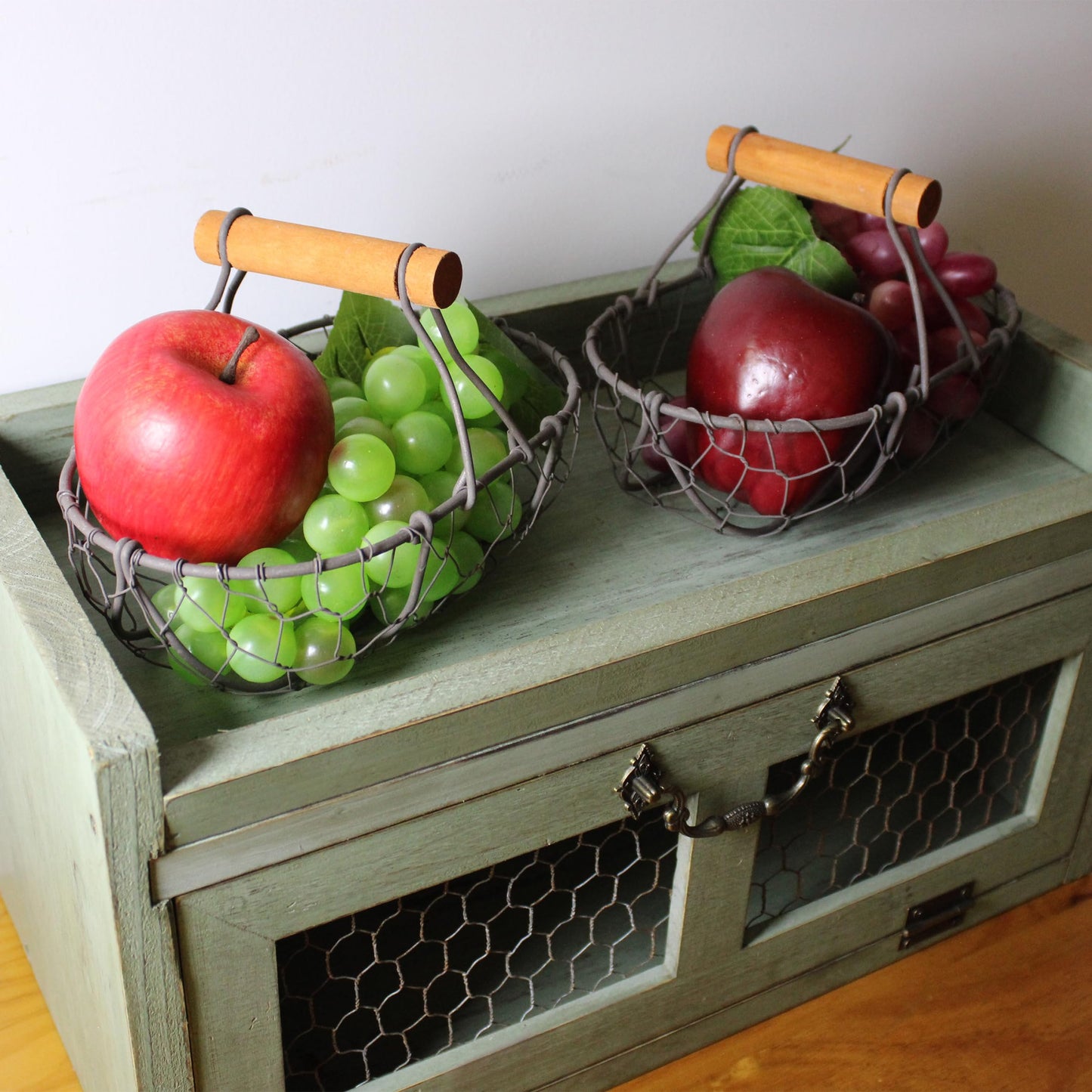 CVHOMEDECO. Chicken Wire Egg Baskets Rust Gathering Baskets with Wooden Handle Country Vintage Style Storage Baskets. Set of 2 (Oval)