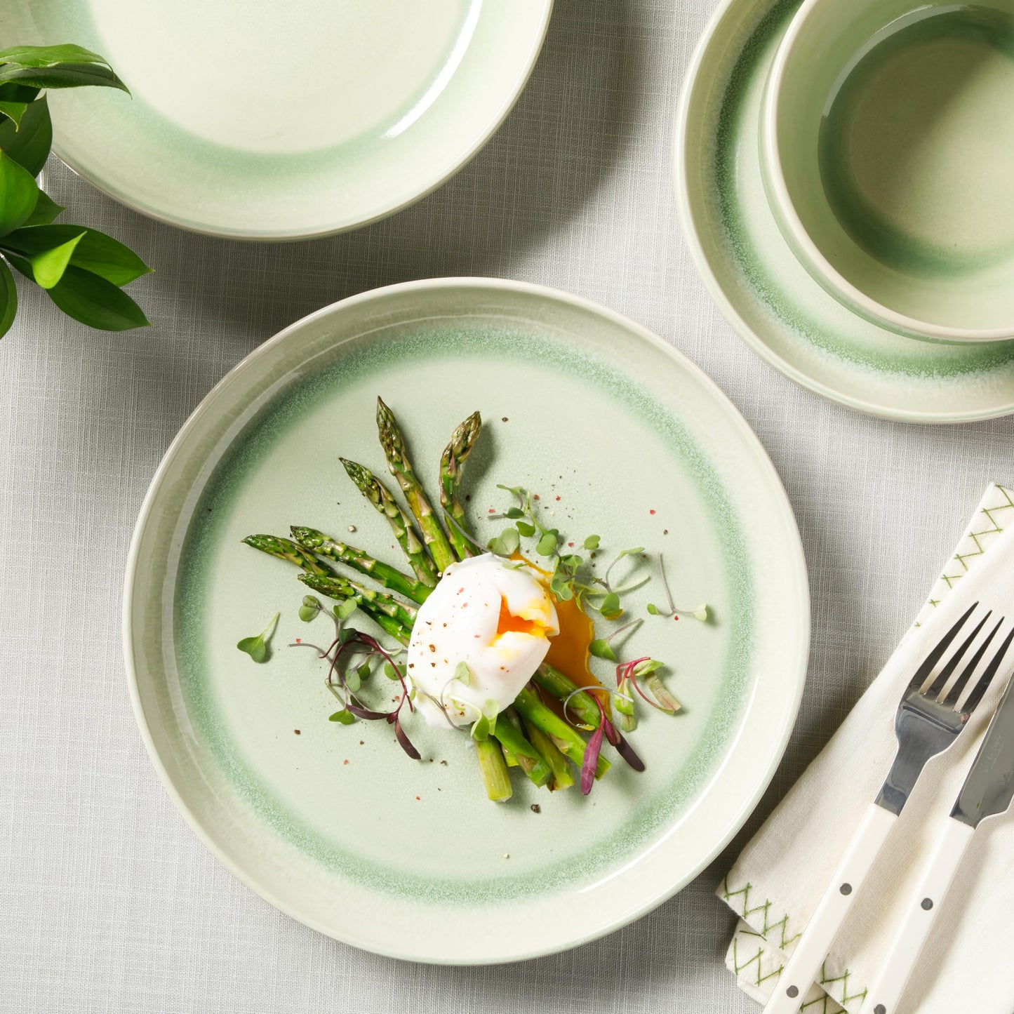 Sur La Table Kitchen Essentials Banquette 16 Piece Double Bowl Plates and Bowls Reactive Glaze Stoneware Dinnerware Set - Green